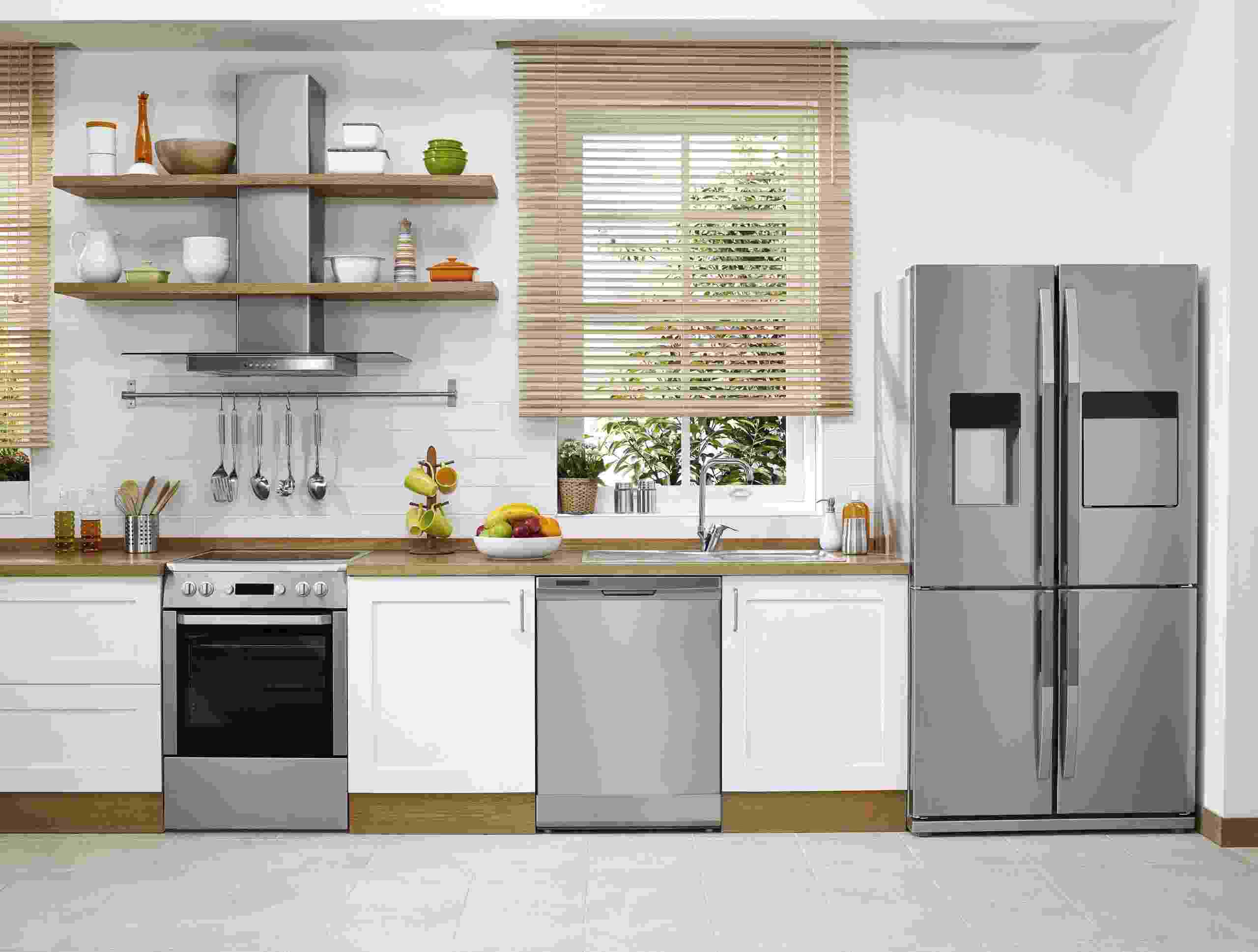 A modern kitchen with stainless steel appliances.
